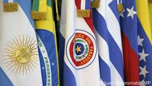 (FILES) In this file photo taken on June 29, 2012, the flags of the countries that are part of Mercosur are seen during the XLIII Mercosur presidential summit in Mendoza, Argentina. - Uruguay informed its Mercosur partners on July 7, 2021, that it would negotiate trade agreements with third countries, which so far required the consensus of the other three members (Argentina, Brazil and Paraguay). (Photo by Juan MABROMATA / AFP)