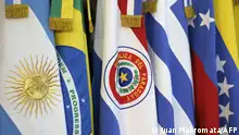 (FILES) In this file photo taken on June 29, 2012, the flags of the countries that are part of Mercosur are seen during the XLIII Mercosur presidential summit in Mendoza, Argentina. - Uruguay informed its Mercosur partners on July 7, 2021, that it would negotiate trade agreements with third countries, which so far required the consensus of the other three members (Argentina, Brazil and Paraguay). (Photo by Juan MABROMATA / AFP)