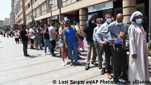 People, most of them residents of Iran stand in line for a vaccine at a mobile vaccination station in the center of Yerevan, Armenia, Friday, July 9, 2021. Armenia’s offer of free coronavirus vaccines to any foreign visitor has drawn many people from neighboring Iran and other countries to the ex-Soviet Caucasus nation. The Iranians initially visited the Armenian border city of Meghri to get the shots, but the Armenian authorities have decided earlier this week that all foreign nationals should get the shots in the Armenian capital, Yerevan. (Lusi Sargsyan/PHOTOLURE via AP)