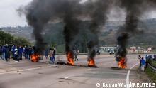 July 9, 2021***
Supporters of former South African President Jacob Zuma block the freeway with burning tyres during a protest in Peacevale, South Africa, July 9, 2021. REUTERS/Rogan Ward