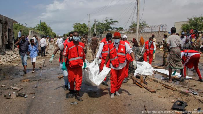 Medical workers carry the body of a civilian