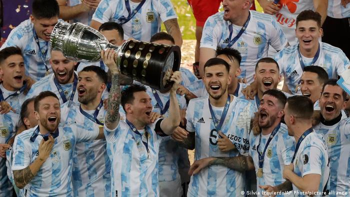 Lionel Messi lifts the Copa America trophy after beating Brazil
