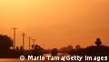 10.07.21 *** THERMAL, CALIFORNIA - JULY 10: Vehicles are viewed above a 'highway mirage' caused by a thin layer of hot air above the roadway on July 10, 2021 near Thermal, California. ‘Dangerously hot conditions’ are expected to hit the Coachella Valley this weekend with possible highs of 115 to 120 degrees, according to the National Weather Service. An excessive heat warning was issued for much of California through Monday. Climate models almost unanimously predict that heat waves will become more intense and frequent as the planet continues to warm. (Photo by Mario Tama/Getty Images)