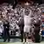 Novak Djokovic lifts the Wimbledon trophy at the All England Club