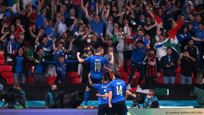 Italian players celebrate their equalizer with their fans