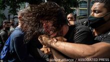 Plainclothes police detain an anti-government protester during a protest in Havana, Cuba, Sunday, July 11, 2021. Hundreds of demonstrators went out to the streets in several cities in Cuba to protest against ongoing food shortages and high prices of foodstuffs, amid the new coronavirus crisis. (AP Photo/Ramon Espinosa)