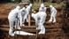 Gravediggers in protective gear lower a COVID-19 victim into the ground in Indonesia Gravediggers in protective gear lower a COVID-19 victim into the ground in Indonesia