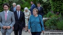 Italy's Prime Minister Mario Draghi, Canada's Prime Minister Justin Trudeau, U.S. President Joe Biden, German Chancellor Angela Merkel, Britain's Prime Minister Boris Johnson, France's President Emmanuel Macron and Britain's Queen Elizabeth attend a drinks reception on the sidelines of the G7 summit, at the Eden Project in Cornwall, Britain June 11, 2021. Jack Hill/Pool via REUTERS