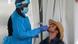 A medic takes a swab from a man for a COVID-19 test A medic takes a swab from a man for a COVID-19 test