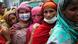 Women wait to buy government subsidiary food during a lockdown in July Women wait to buy government subsidiary food during a lockdown in July