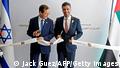 14.07.2021
Israeli President Isaac Herzog (L) and Emirati Ambassador to Israel Mohamed al-Khaja cut the ribbon at the new UAE embassy in Tel Aviv on July 14, 2021. - The United Arab Emirates opened its embassy in Israel, housed in Tel Aviv's new stock exchange building, in the latest step solidifying ties after a US-brokered normalisation deal last year. The venue in the heart of Israel's financial district highlighted the central role economic cooperation has played since UAE became only the third majority Arab nation to recognise the Jewish state. (Photo by JACK GUEZ / AFP) (Photo by JACK GUEZ/AFP via Getty Images)