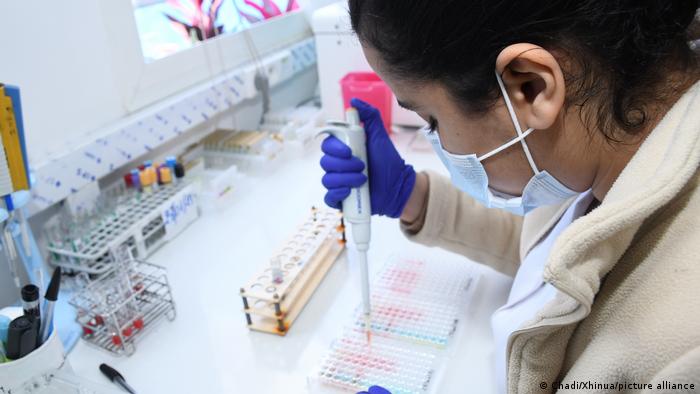 A health worker processes samples collected for COVID-19 tests in a laboratory in Rabat, Morocco.