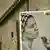 An image of Syrian human rights lawyer Razan Zaitouneh, who was disappeared in December 2013, hangs on a door