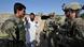 US Army troops speaking with an Afghan civilian through an interpreter in eastern Afghanistan in June 2011 US Army troops speaking with an Afghan civilian through an interpreter in eastern Afghanistan in June 2011