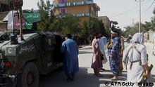 Afghan security personnel stand guard along a road amid ongoing fight between Afghan security forces and Taliban fighters in the western city of Qala-i- Naw, the capital of Badghis province, on July 7, 2021 - The Taliban launched a major assault on a provincial capital in Afghanistan on July 7, the first since the US military began its final drawdown of troops from the country, as insurgents press on with a blistering offensive. (Photo by - / AFP) (Photo by -/AFP via Getty Images)