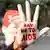 An activist with face and hand painted with HIV/AIDS awareness message during a campaign on the eve of Worlds AIDS Day