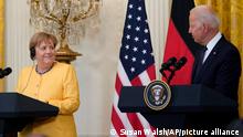 German Chancellor Angela Merkel smiles as President Joe Biden speaks during a news conference in the East Room of the White House in Washington, Thursday, July 15, 2021. (AP Photo/Susan Walsh)