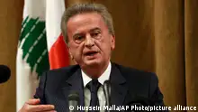 Riad Salameh, the governor of Lebanon's Central Bank, speaks during a press conference, in Beirut, Lebanon, Nov. 11, 2019. On Monday, Jan. 25, 2021, Lebanon’s foreign minister held talks Monday, Jan 25, 2021, with the Swiss ambassador to Beirut after Switzerland started a probe into possible money laundering and embezzlement at the Mideast country’s central bank. On Monday, the governor issued a statement saying reports about large transfers “are very exaggerated and have nothing to do with reality.” (AP Photo/Hussein Malla)