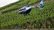 A helicopter lands in the vineyards A helicopter lands in the vineyards