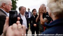 17/07/2021***
Bundespräsident Frank-Walter Steinmeier (l-r), Ministerpräsident Armin Laschet (CDU) und Carolin Weitzel (CDU), Bürgermeisterin von Erftstadt, sprechen mit einem Anwohner in Erftstadt. Steinmeier und Laschet wollen sich vor Ort ein Bild der Schäden durch das Hochwasser machen. +++ dpa-Bildfunk +++