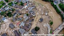 Destroyed houses are seen close to the Ahr river in Schuld, Germany, Thursday, July 15, 2021. Due to heavy rain falls the Ahr river dramatically went over the banks the evening before. People have died and dozens of people are missing in Germany after heavy flooding turned streams and streets into raging torrents, sweeping away cars and causing some buildings to collapse. (AP Photo/Michael Probst)