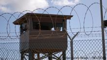 FILE PHOTO: A soldier stands guard in a tower overlooking Camp Delta at Guantanamo Bay naval base in a December 31, 2009 file photo provided by the US Navy. REUTERS/US Navy/Spc. Cody Black/Handout via Reuters THIS IMAGE HAS BEEN SUPPLIED BY A THIRD PARTY. IT IS DISTRIBUTED, EXACTLY AS RECEIVED BY REUTERS, AS A SERVICE TO CLIENTS. FOR EDITORIAL USE ONLY. NOT FOR SALE FOR MARKETING OR ADVERTISING CAMPAIGNS/File Photo/File Photo