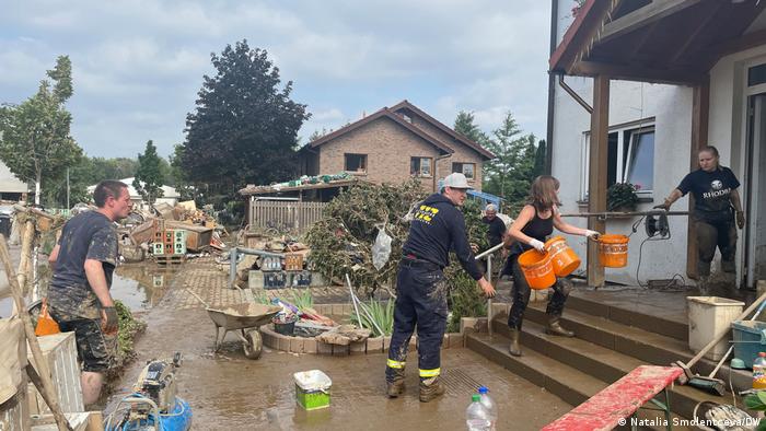 Clearing dirty water out of a house in Sinzig