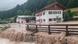 Water flowing into and past homes in Berchtesgadener Land, Bavaria Water flowing into and past homes in Berchtesgadener Land, Bavaria