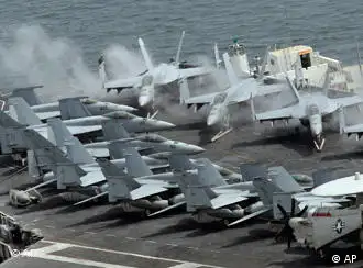 U.S. carrier based aircraft rest on the flight deck of nuclear-powered aircraft carrier, USS George Washington at the Busan port in Busan, south of Seoul, South Korea, Saturday, July 24, 2010. North Korea warned Saturday that joint U.S. and South Korean military exercises poised to begin this weekend amount to a military provocation that will draw a powerful nuclear response from Pyongyang. (AP Photo/Lee Jin-man)