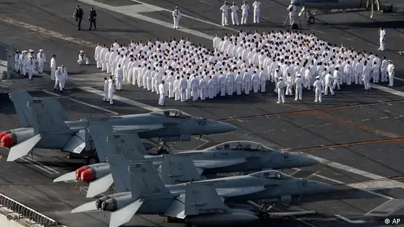 U.S. Navy sailors of the Nimitz-class USS George Washington prepare to leave for joint military exercises with South Korea at the Busan port in Busan, south of Seoul, South Korea, Sunday, July 25, 2010. The massive nuclear-powered U.S. supercarrier began maneuvers Sunday with ally South Korea in a potent show of force that North Korea has threatened could lead to sacred war. (AP Photo/ Lee Jin-man)