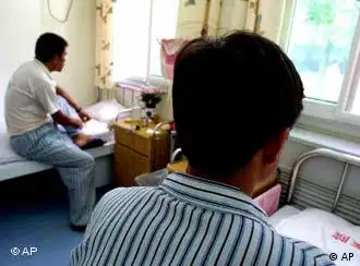 Two AIDS patients, who did not want to be identified, rest in their room at a hospital in Beijing Thursday, Aug. 23, 2001. China registered a sharp increase in reported cases of HIV infections this year, and infection rates among drug users and prostitutes are climbing, the Ministry of Health reported Thursday. (AP Photo/Greg Baker)