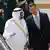 Saudi King Abdullah, left, and Syrian President Bashar Assad, right, talk to each other