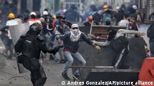 Demonstrators clash with the police during an anti-government protest in Cali, Colombia, Tuesday, July 20, 2021, as the county marks its Independence Day. (AP Photo/Andres Gonzalez)