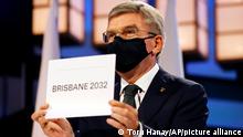 21.07.2021
President of the International Olympic Committee Thomas Bach announces Brisbane as the 2032 Summer Olympics host city during the 138th IOC Session at Hotel Okura in Tokyo, Wednesday, July 21, 2021. (Toru Hanai/Pool Photo via AP)