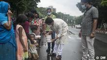 Tanbir Hasan Shaikat, distributing food to the poor at Eid Day on Dhaka steer