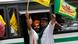 Farmers shout slogans as they arrive in a bus Farmers shout slogans as they arrive in a bus