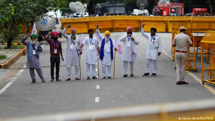 Farmers shout slogans during a sit-in protest near the parliament house in New Delhi