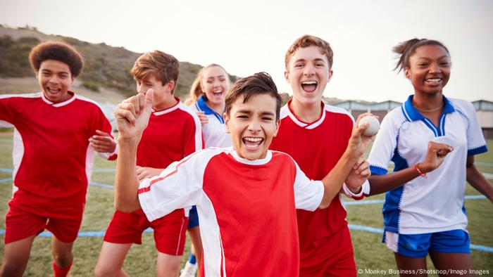 boys and girls playing soccer