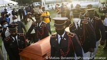 Police carry the coffin of slain Haitian President Jovenel Moise at the start of the funeral at his family home in Cap-Haitien, Haiti, early Friday, July 23, 2021. Moise was assassinated at his home in Port-au-Prince on July 7. (AP Photo/Matias Delacroix)
