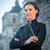 Portrait of Oksana Lyniv with conductor's baton at the Bayreuth Festival 2021.