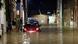 People wade through flooded streets of Belgium's Namur following heavy rains on July 24 People wade through flooded streets of Belgium's Namur following heavy rains on July 24