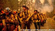 July 23, 2021***
Cal Fire firefighters battle the Dixie Fire near Prattville in Plumas County, Calif., on Friday, July 23, 2021. (AP Photo/Noah Berger)