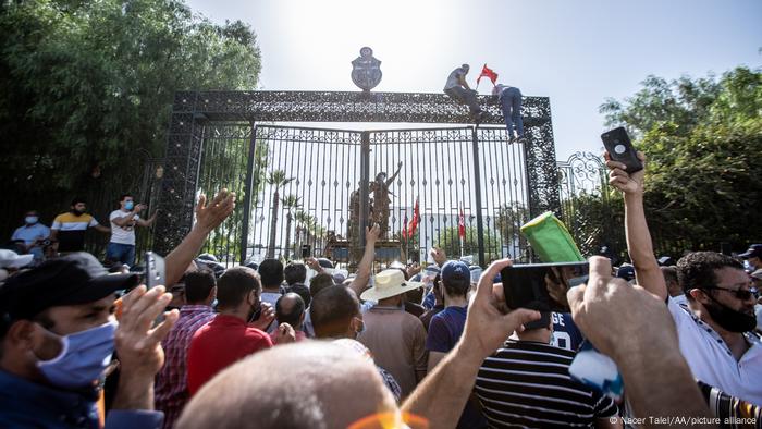 Tunisian protesters gathered in front of parliament building in Tunis. 
