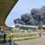 Plumes of black smoke extend across the sky following the explosion in Leverkusen