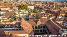 Tiled roofs of Bologna city, Italy. Panoramic view from above, italian cityscape