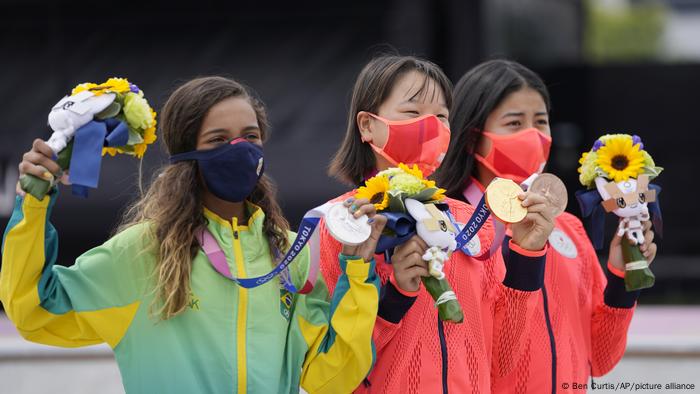 From left to right, silver medalist Rayssa Leal of Brazil, gold medalist Momiji Nishiya of Japan, middle and bronze medalist Funa Nakayama of Japan.