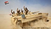 Iraqi forces backed by the Hashed Al-Shaabi (Popular Mobilization units) advance towards the town of Tal Afar, west of Mosul, after the Iraqi government announced the beginning of the operation to retake it from the control of the Islamic State (IS) group on August 22, 2017. Iraqi forces recaptured from the Islamic State group the first two districts of jihadist bastion Tal Afar, as the Pentagon chief visited Baghdad in a show of support. / AFP PHOTO / AHMAD AL-RUBAYE (Photo credit should read AHMAD AL-RUBAYE/AFP via Getty Images)