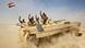 Iraqi soldiers wave from a tank in the desert. Iraqi soldiers wave from a tank in the desert.
