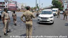 Police issue challan to people during government imposed lockdown in wake of coronavirus in Allahabad. (Photo by Prabhat Kumar Verma/Pacific Press)