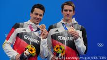 Tokyo 2020 Olympics - Diving - Men's 3m Springboard Synchro - Medal Ceremony - Tokyo Aquatics Centre, Tokyo, Japan, July 28, 2021. Patrick Hausding of Germany and Lars Rudiger of Germany pose with the bronze medal REUTERS/Aleksandra Szmigiel